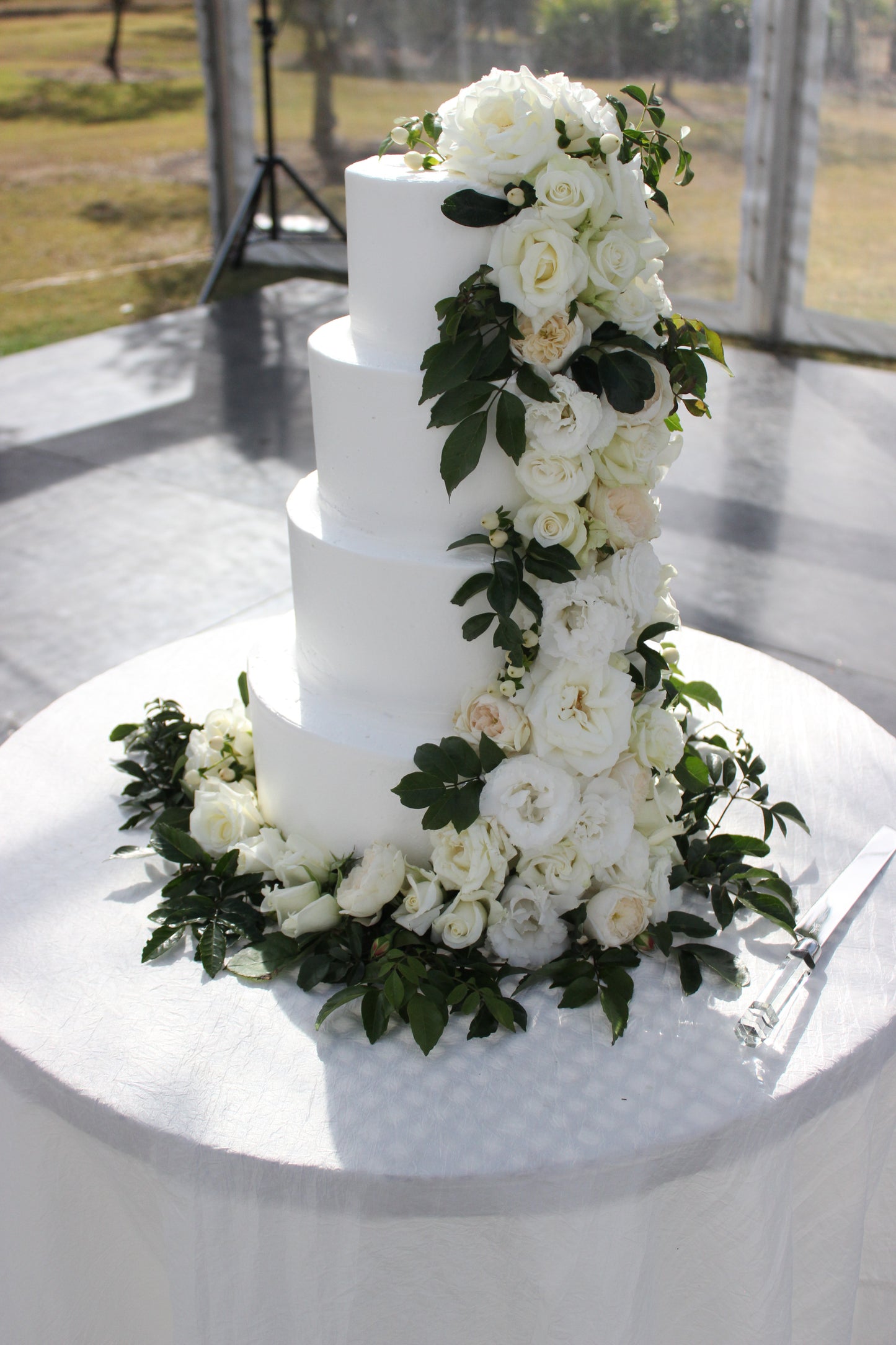4 Tier Buttercream With White Cascading Flowers