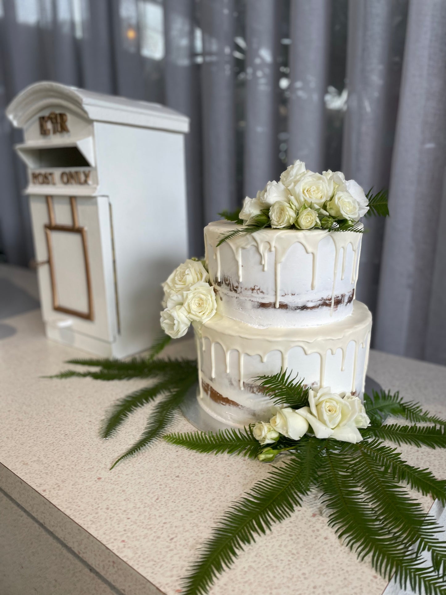 2 Tier Semi Naked with White Drizzle & White Flowers