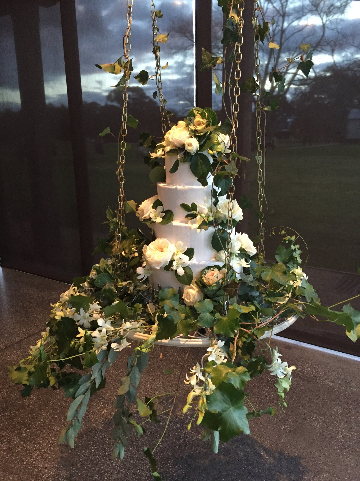 Hanging 4 tier Cake White Buttercream, With Greenery