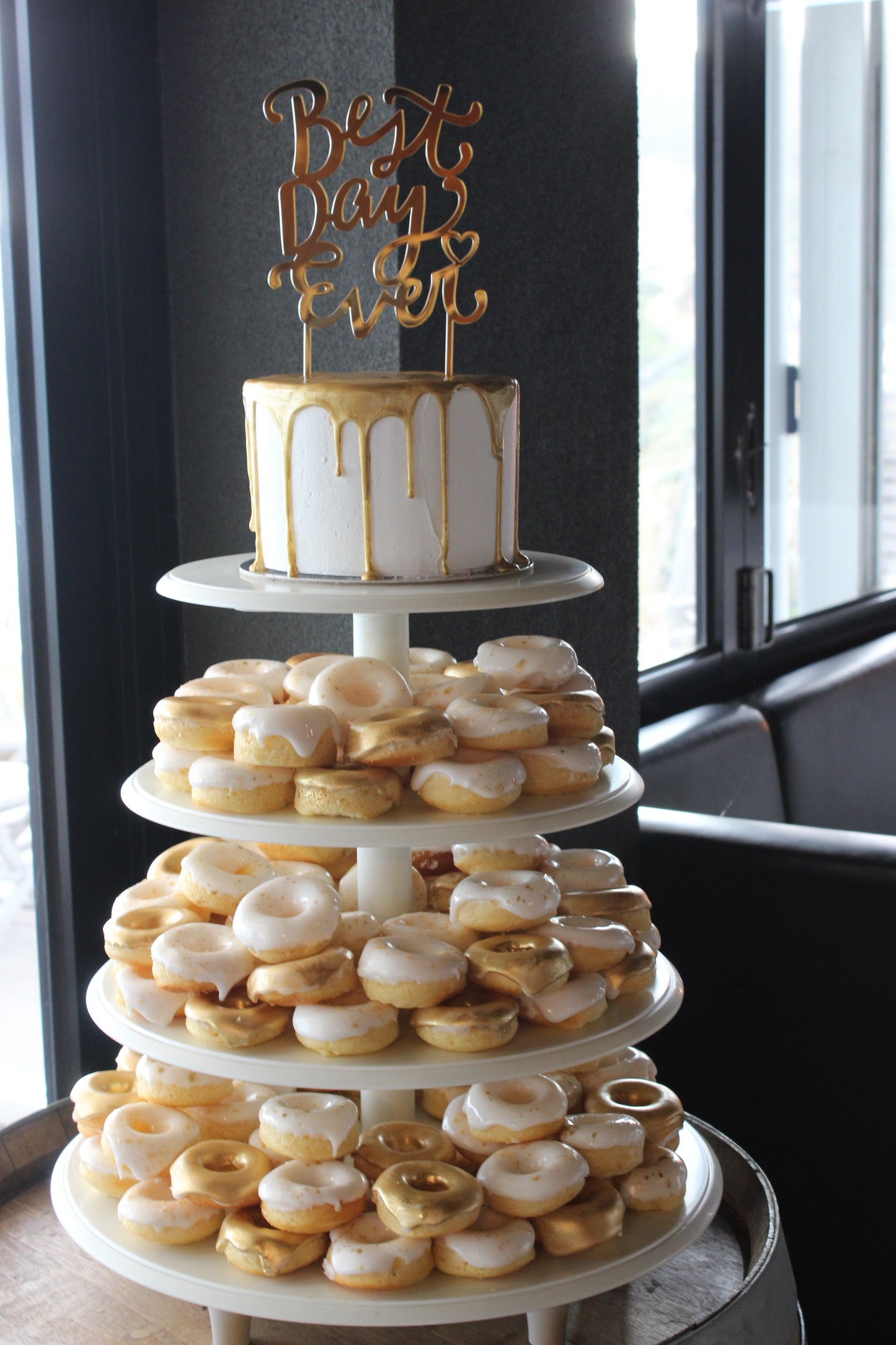 Gold & White Donut Tower with Cutting Cake