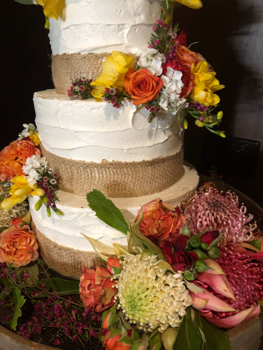 3 Tier Rough Buttercream with Bright Country Flowers