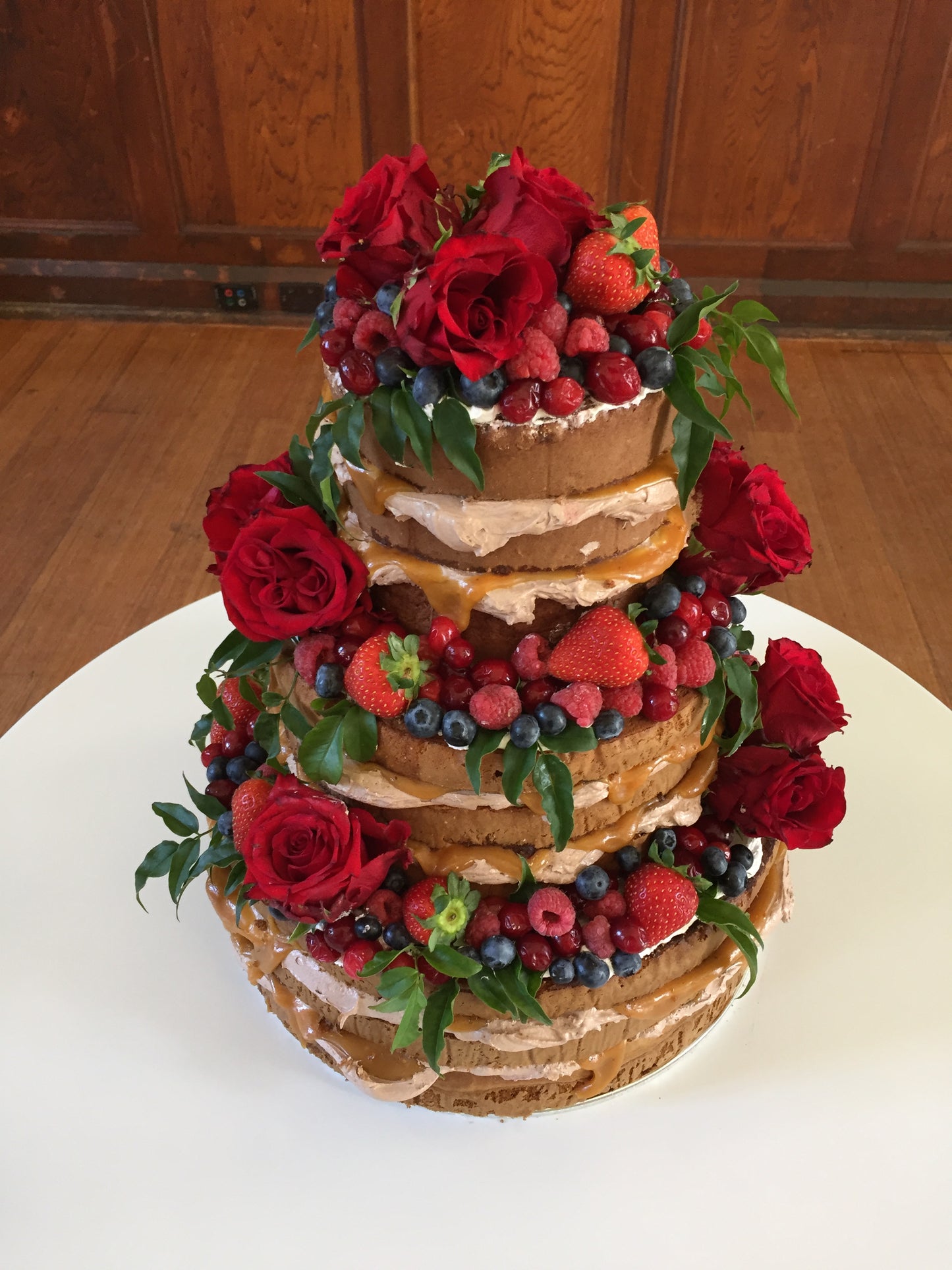 3 Tier Naked Chocolate Cake With Red Flowers & Berries