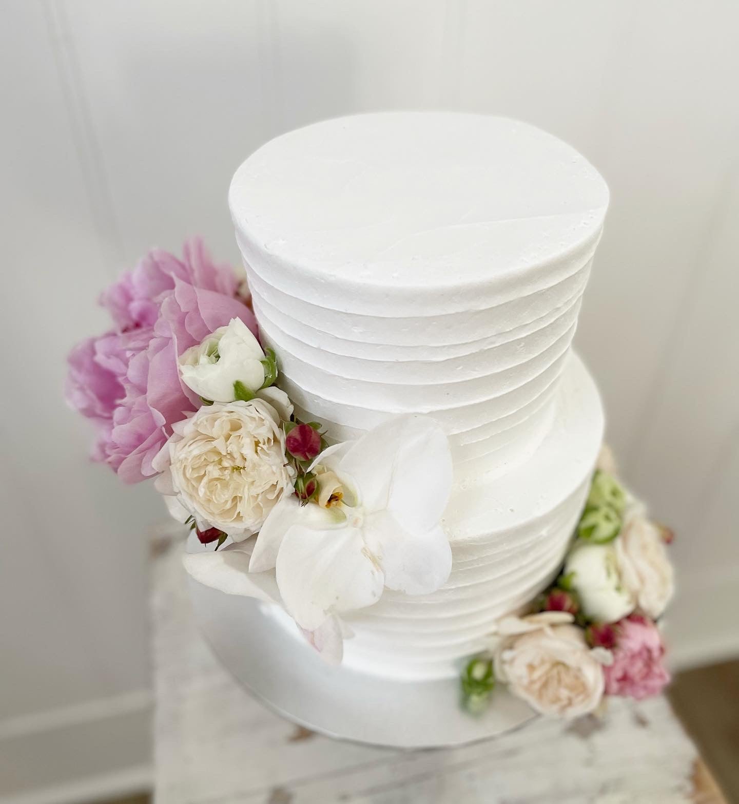2 Tier Line Buttercream Cake with Pink & White Flowers