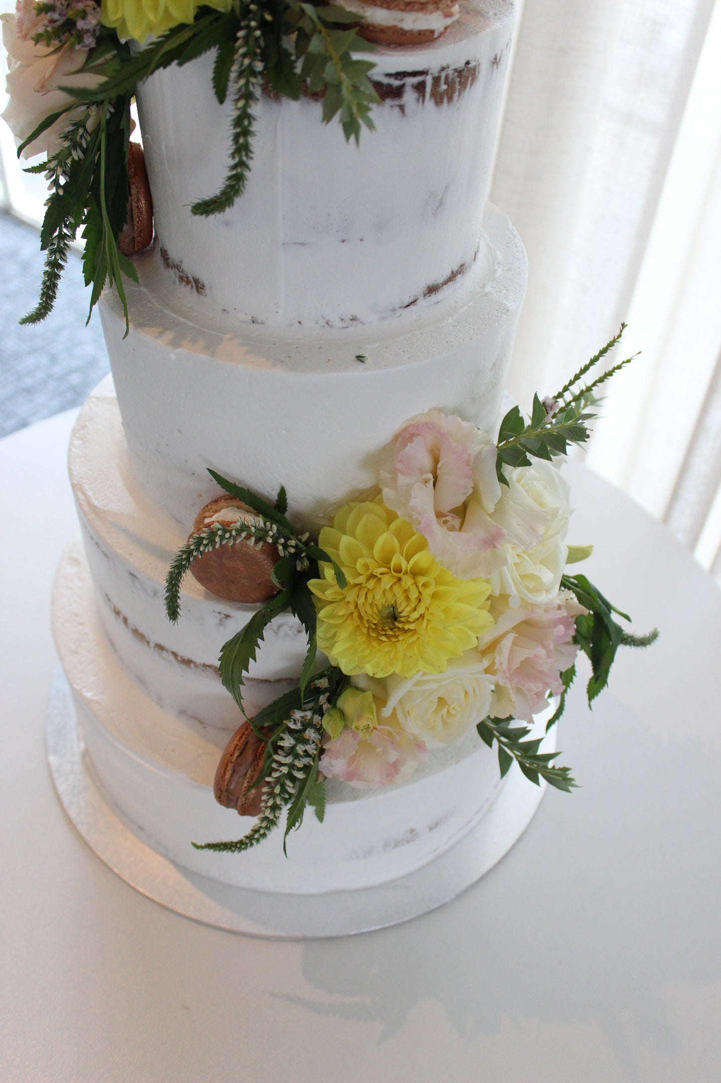 4 Tier Semi Naked with Flowers and Rose Gold Macarons