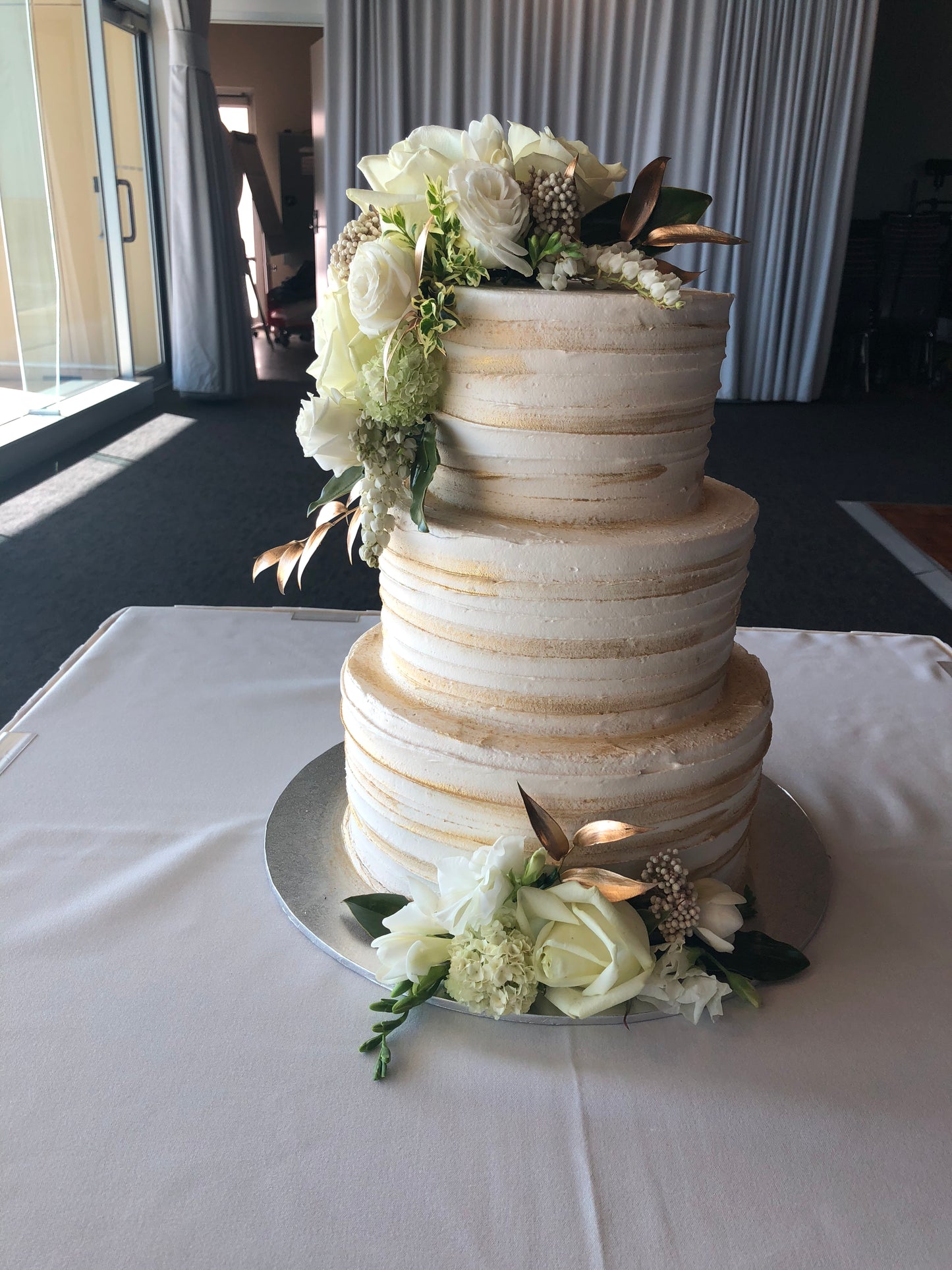 3 Tier Line Buttercream with Brush of Gold and White Flowers