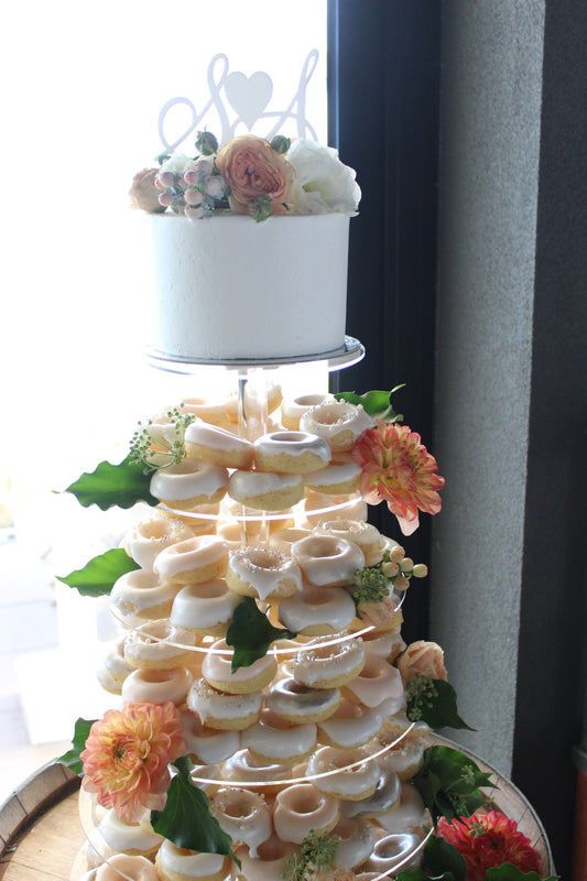 White Donut Tower with Cutting Cake
