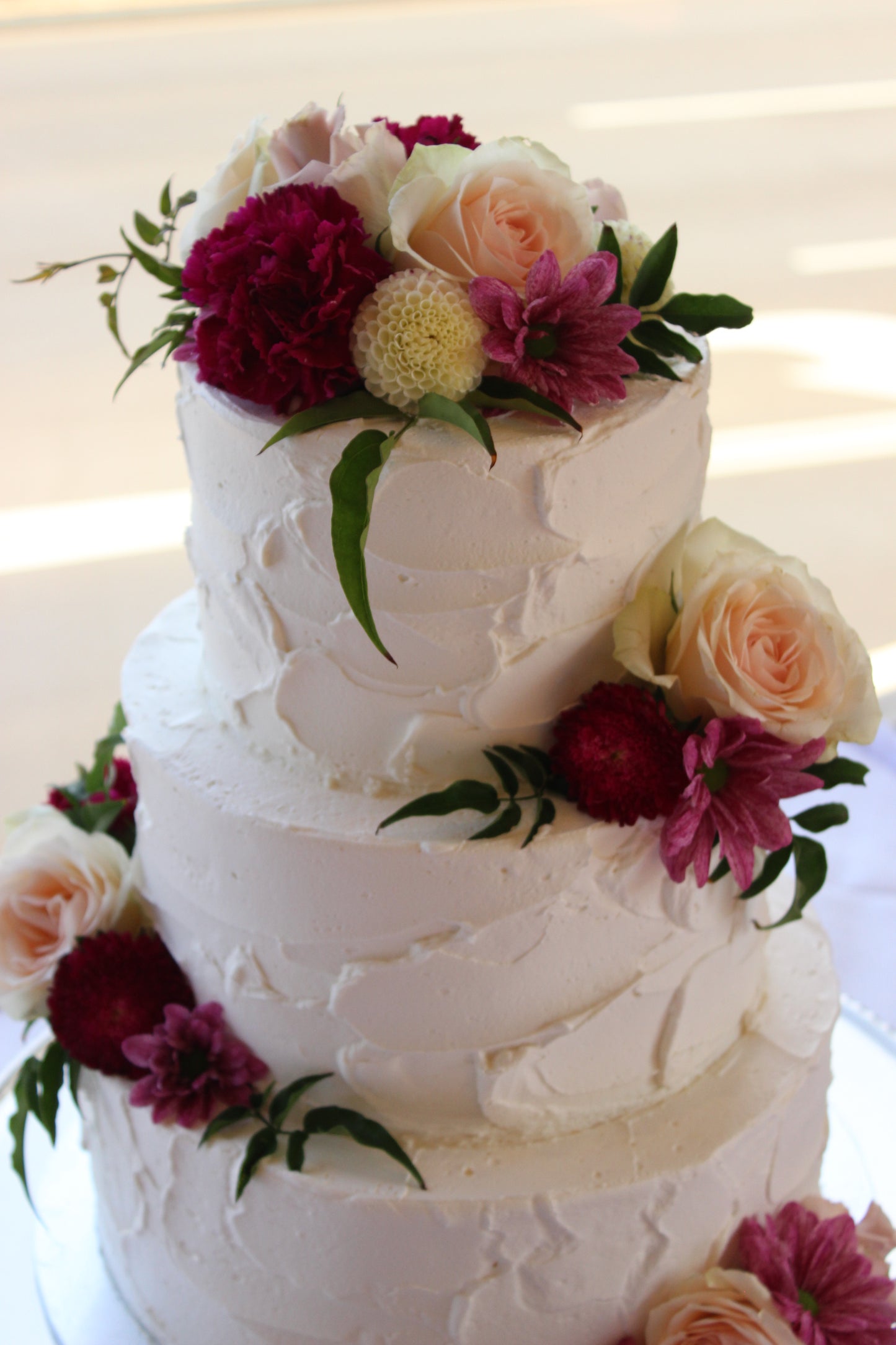 3 Tier Rough Buttercream with Bright Flowers