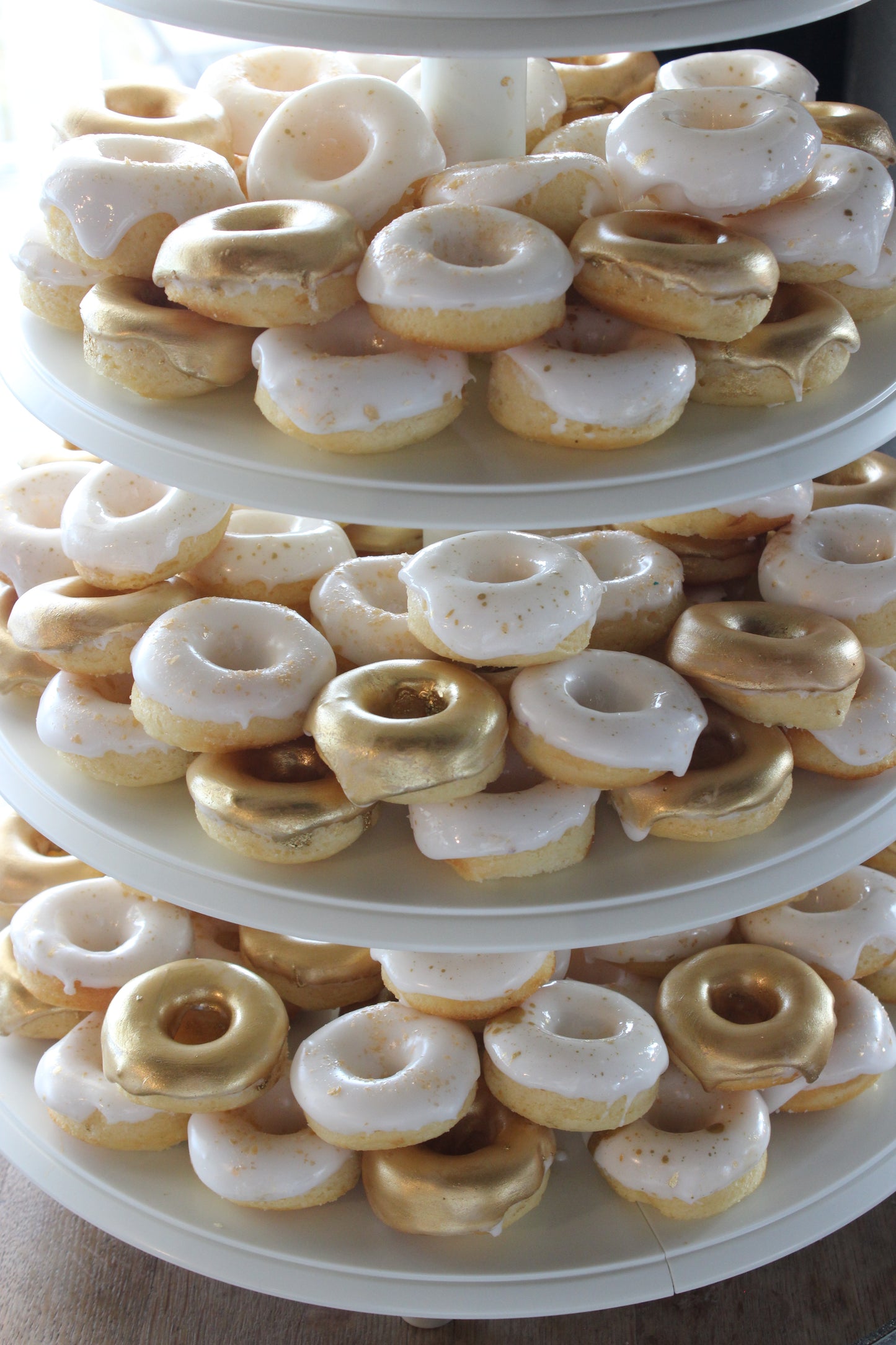 Gold & White Donut Tower with Cutting Cake
