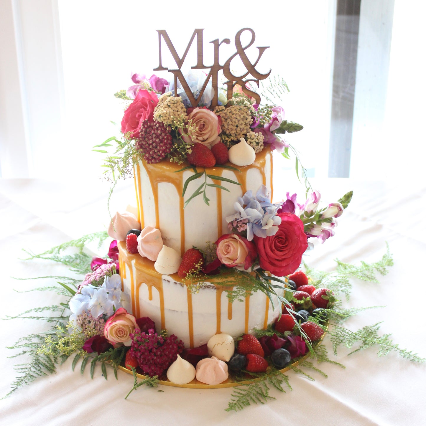 2 Tier Semi Naked Caramel Drizzle with Bright Flowers