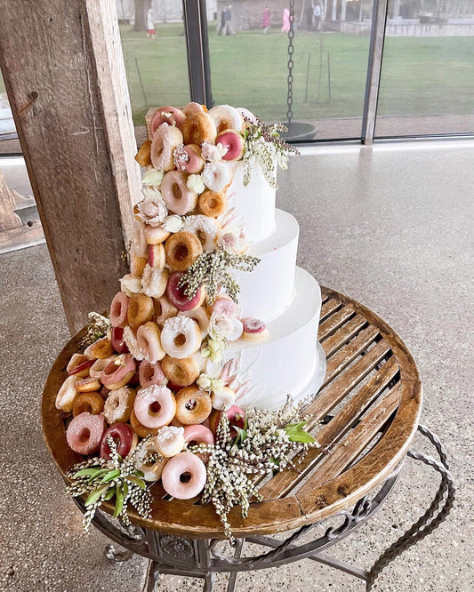 3 tier Pink, Burgundy and Ivory Buttercream With Cascading Donuts