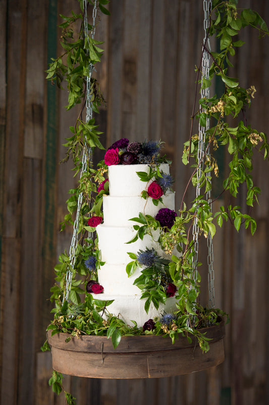 Hanging 4 Tier Buttercream with green and red Flowers