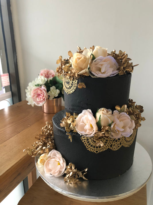 2 Tier Black Buttercream with Gold Lace & Flowers